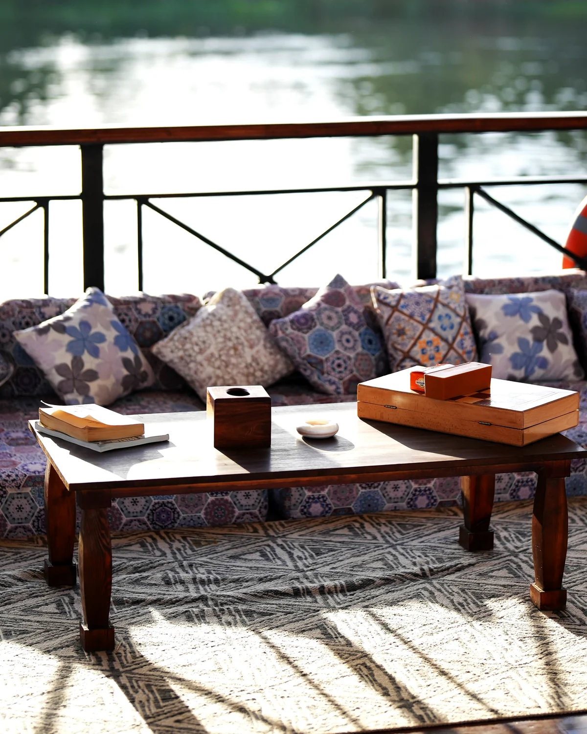 Shaded deck seating with cushions and Nile view aboard Fatima Dahabeya