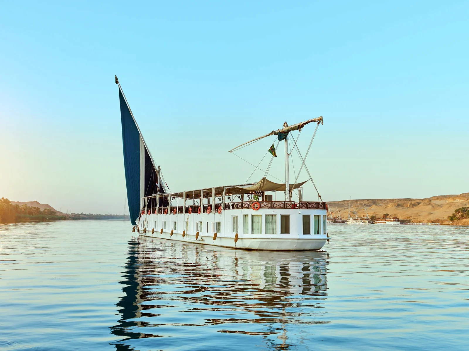 Fatima Dahabeya sailing on the Nile with traditional sails raised