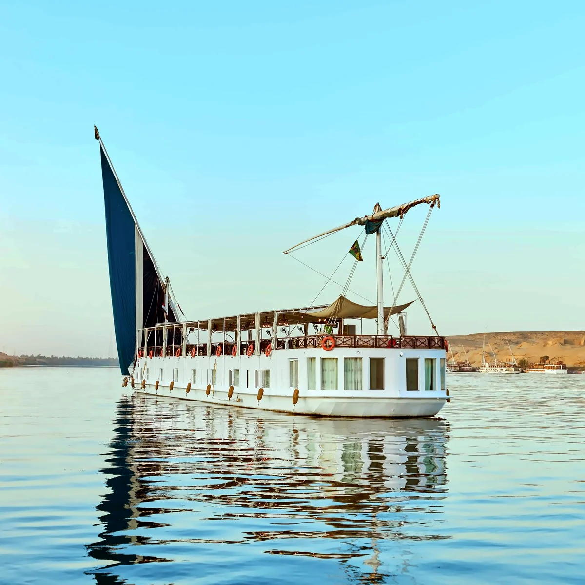 Fatima Dahabeya under sail on calm Nile water